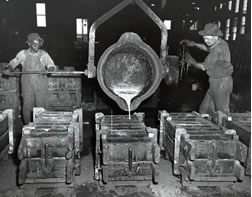 men pouring molten iron